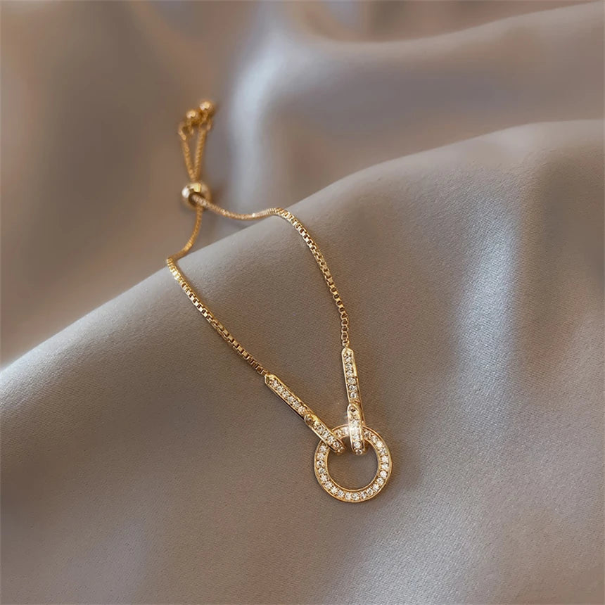 Gold Circular Interlock Cubic Zirconia Drawstring Adjustable Chain Bracelet